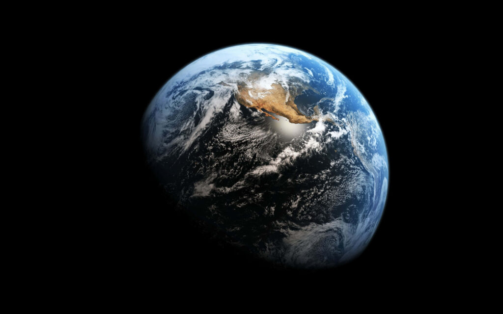 Stunning Earth Wallpaper: Shadowed Planet Against Space's Vastness