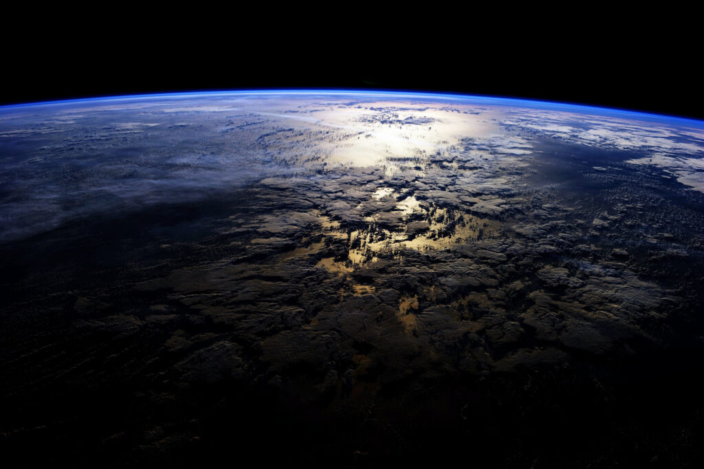 Stunning Planetary Wallpaper: Celestial View with Illuminated Islands