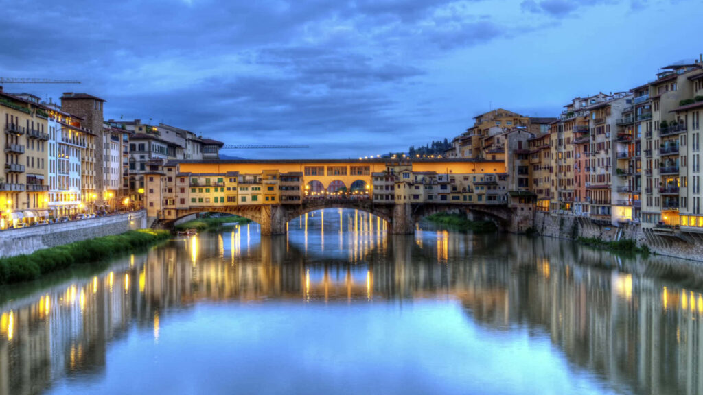 Stunning Ponte Vecchio Nightview: Florence's Illuminated Charm Wallpaper