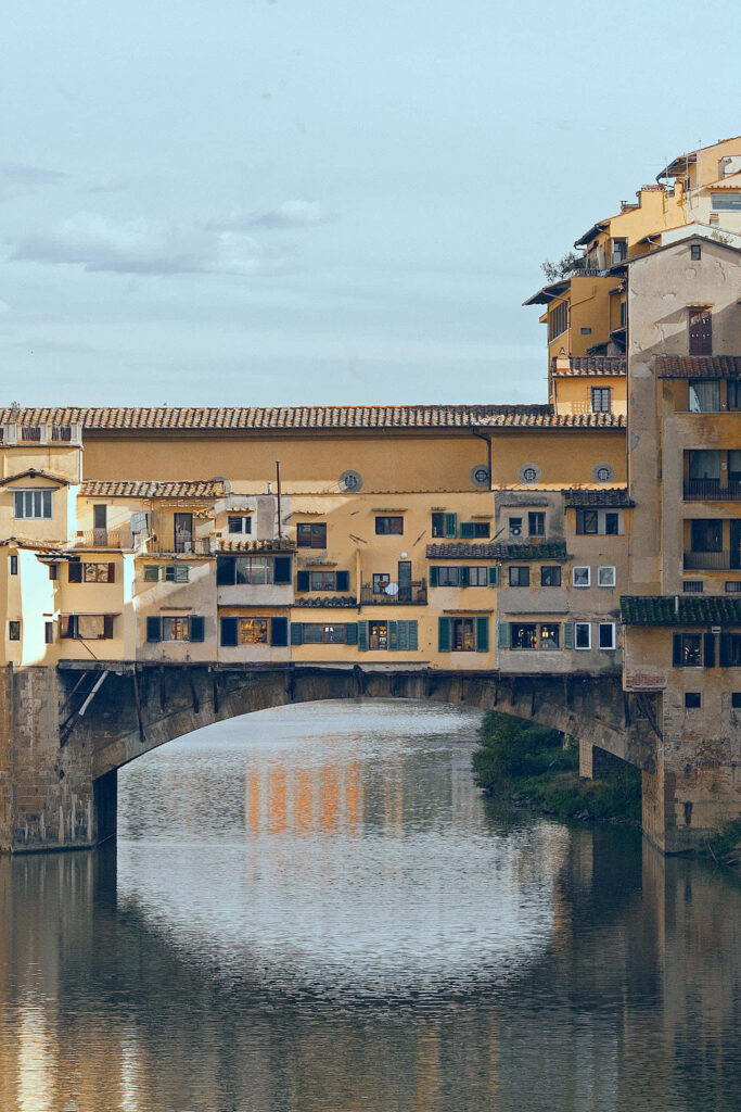 Historic Ponte Vecchio Wallpaper: Iconic Bridge in Vibrant Italy