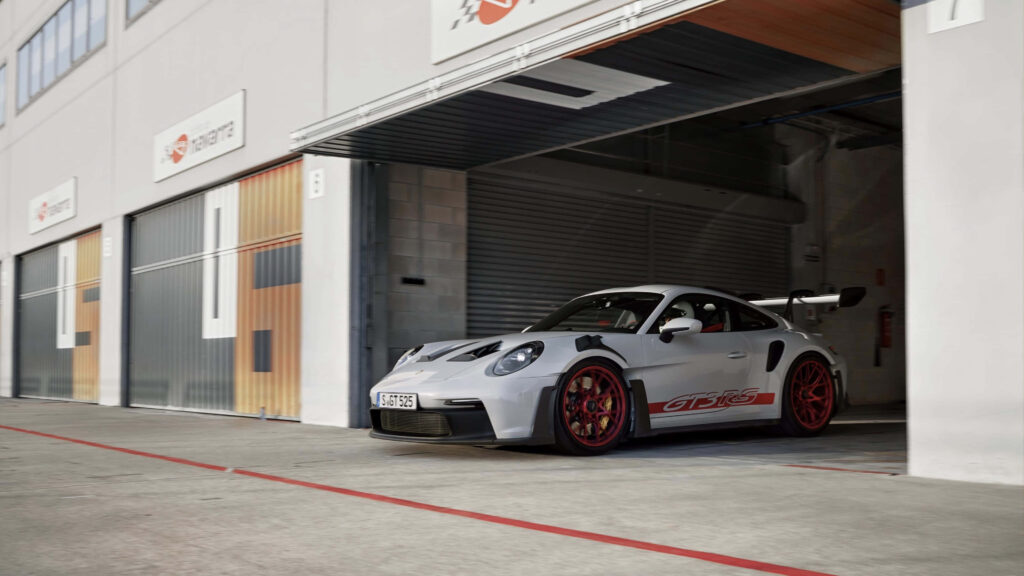 Stunning Porsche GT3 RS Wallpaper: White Car at Racetrack Garage