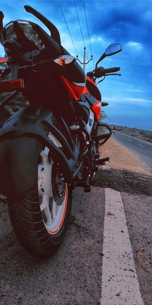Stylish Pulsar 150 Motorcycle Wallpaper: Bold Red & Black Design