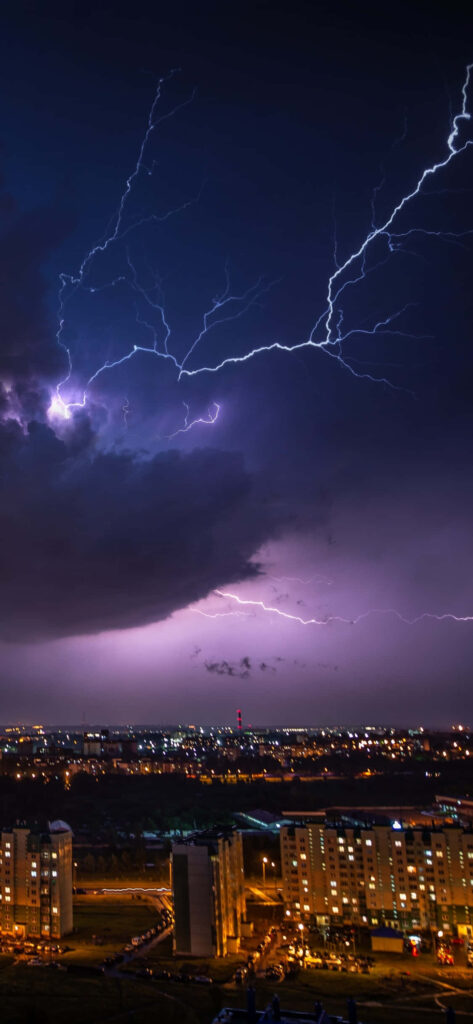 Vivid Purple Lightning Wallpaper: Dramatic Night Sky & Cityscape Background
