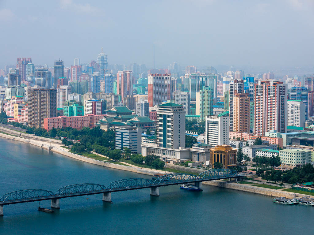 Panoramic Pyongyang Skyline Wallpaper: Taedong River Bridge View