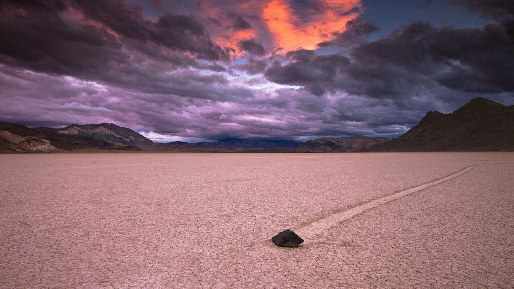 Stunning Racetrack Playa Wallpaper: Dark Clouds & Fiery Sunset