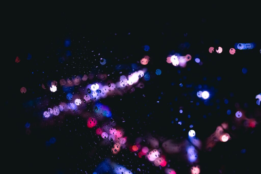 Stunning Rain Drops on Glass Wallpaper with Bokeh and Colorful Glare