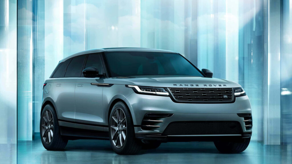 Elegant Range Rover Vogue in Modern Dark Room Wallpaper Background