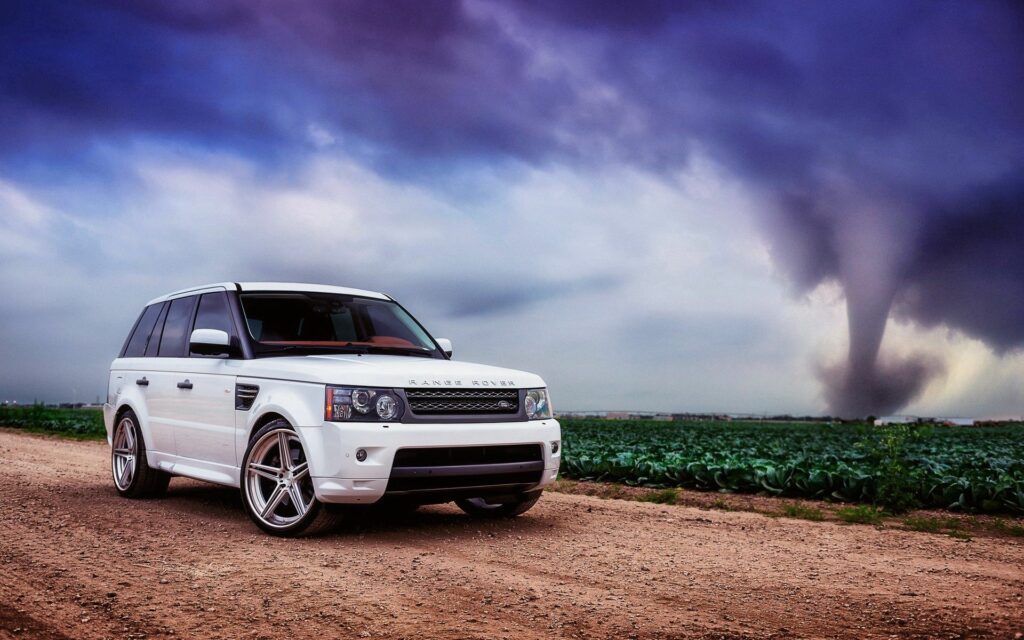Sleek White Range Rover on Dirt Path with Dramatic Sky Wallpaper