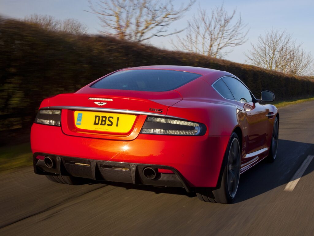 Stunning 2011 Aston Martin DBS in Vibrant Red - Speedy Rear View Wallpaper