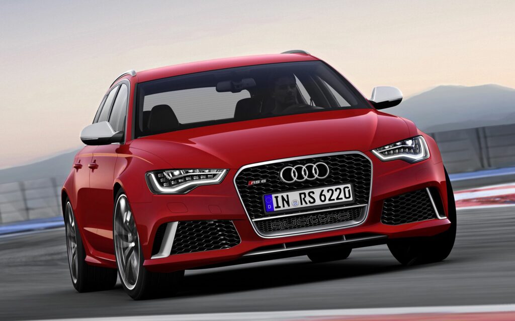 Dynamic Red Audi RS6 Wallpaper: Speed & Elegance in Blurred Background