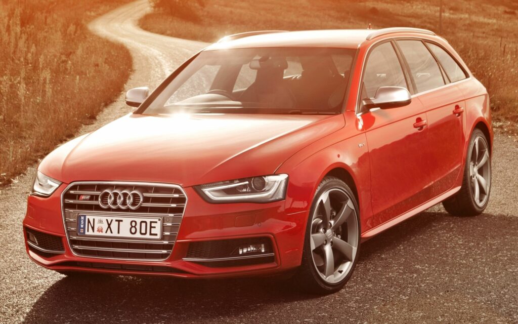 Stunning Red Audi S4 Avant on Open Road - Vibrant Wallpaper