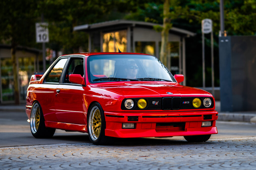 Stunning Red BMW Wallpaper: Bold Front View Urban Background