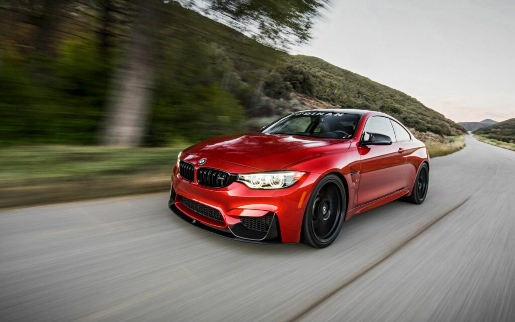 Stunning Red BMW M4 F82 Wallpaper: Sleek Design & Speed on Road