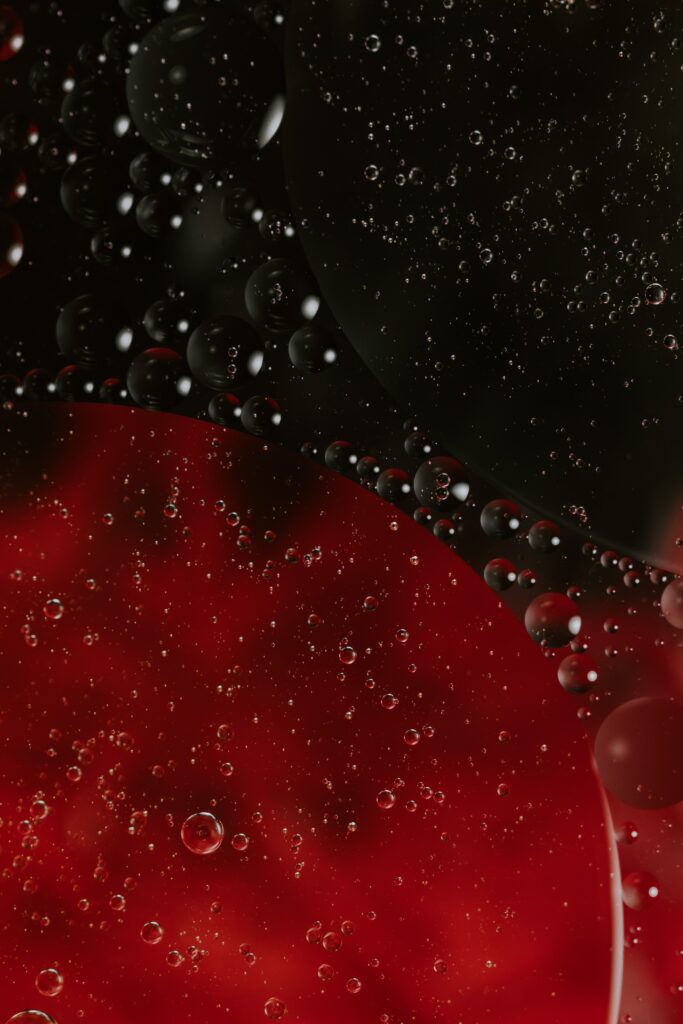 Vibrant Red & Black Macro Wallpaper: Liquid Texture with Bubbles