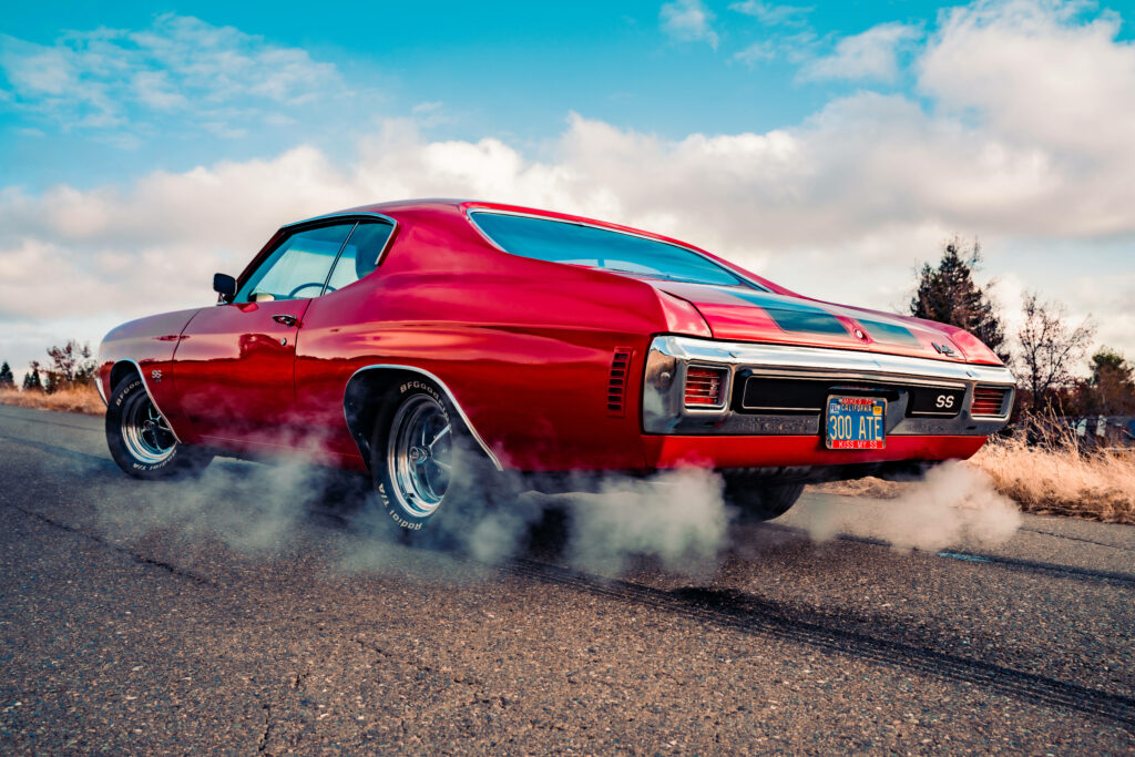 Stunning Red Chevrolet Chevelle in Motion - Classic Muscle Wallpaper