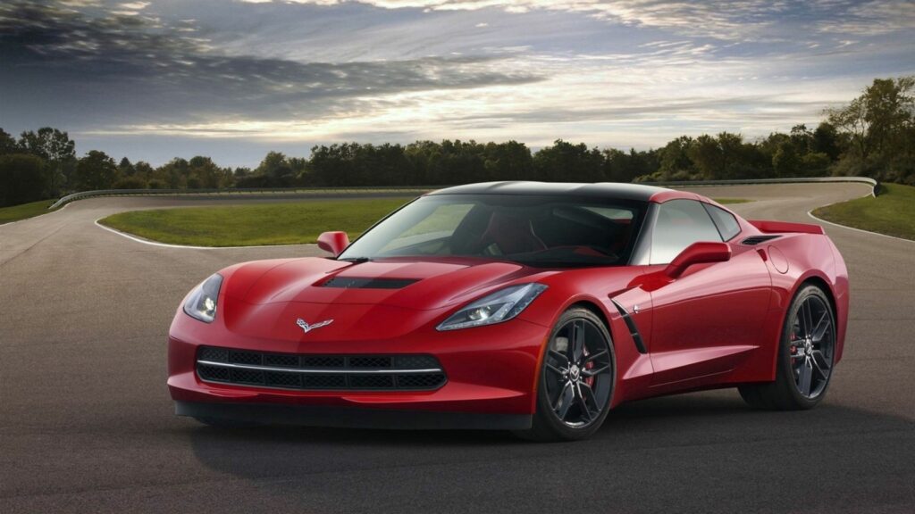 Stunning Red Chevrolet Corvette C7 Wallpaper on Racetrack
