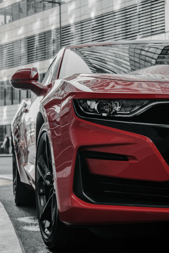 Stunning Red Chevrolet Wallpaper: Sleek Design & Urban Backdrop