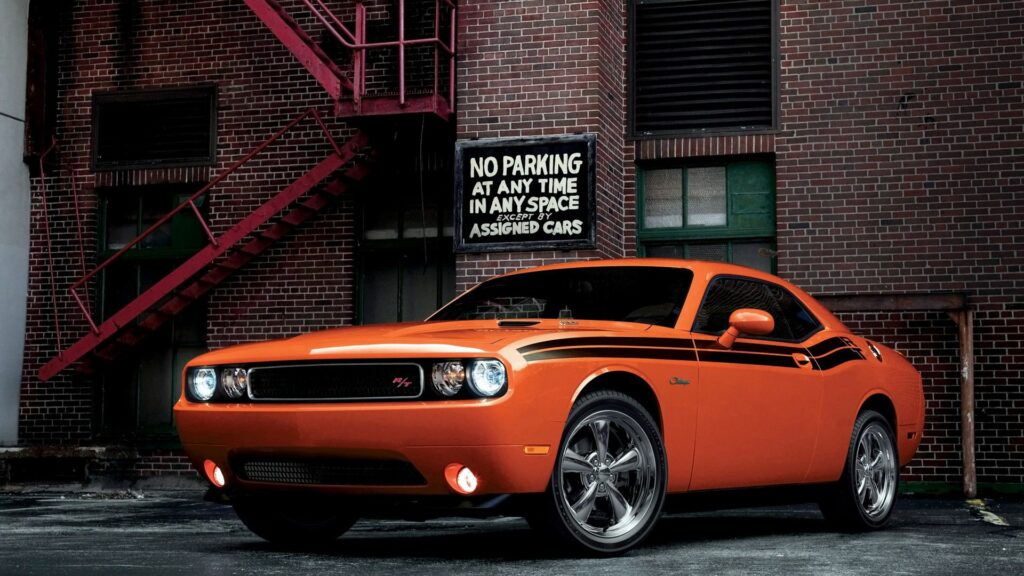 Red Dodge Challenger RT: Bold Urban Wallpaper with Brick Background