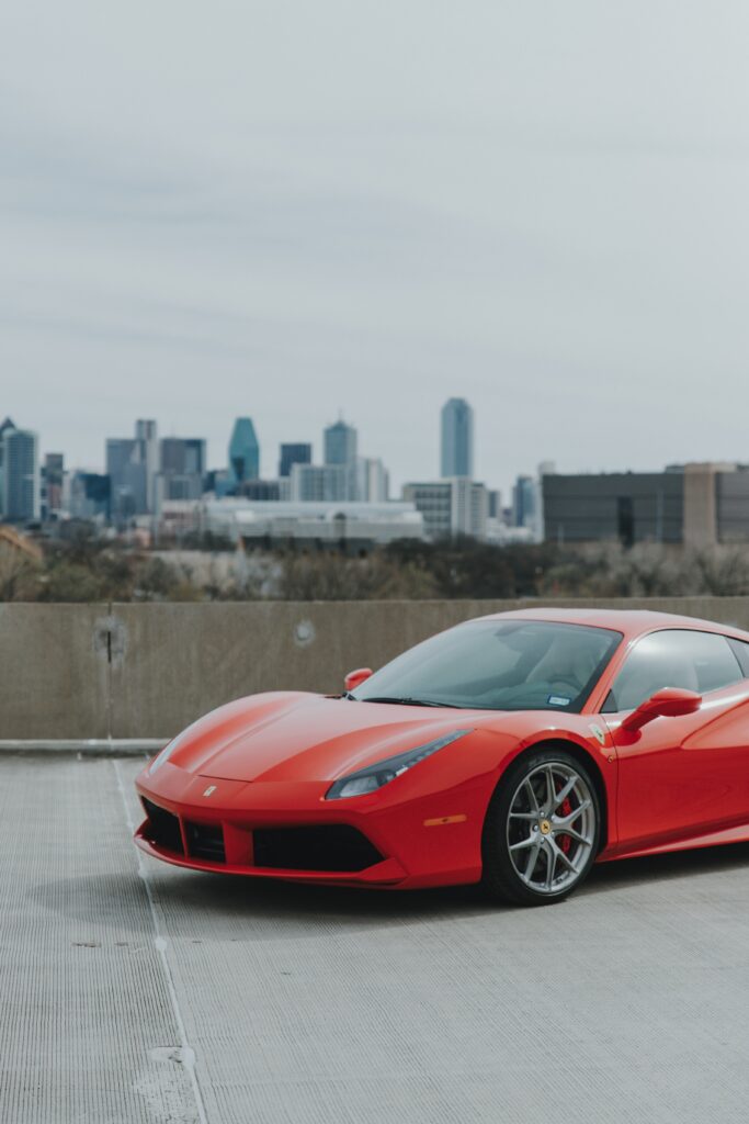 Stunning Red Ferrari 458 Side View Wallpaper in Urban Setting