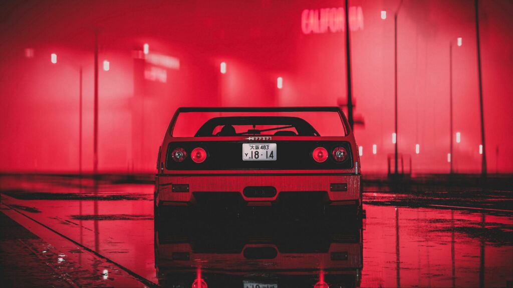 Red Ferrari in Neon-Lit Urban Nightscape Wallpaper