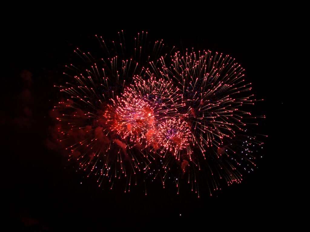 Vibrant Red Fireworks Wallpaper Background for Festive Celebrations