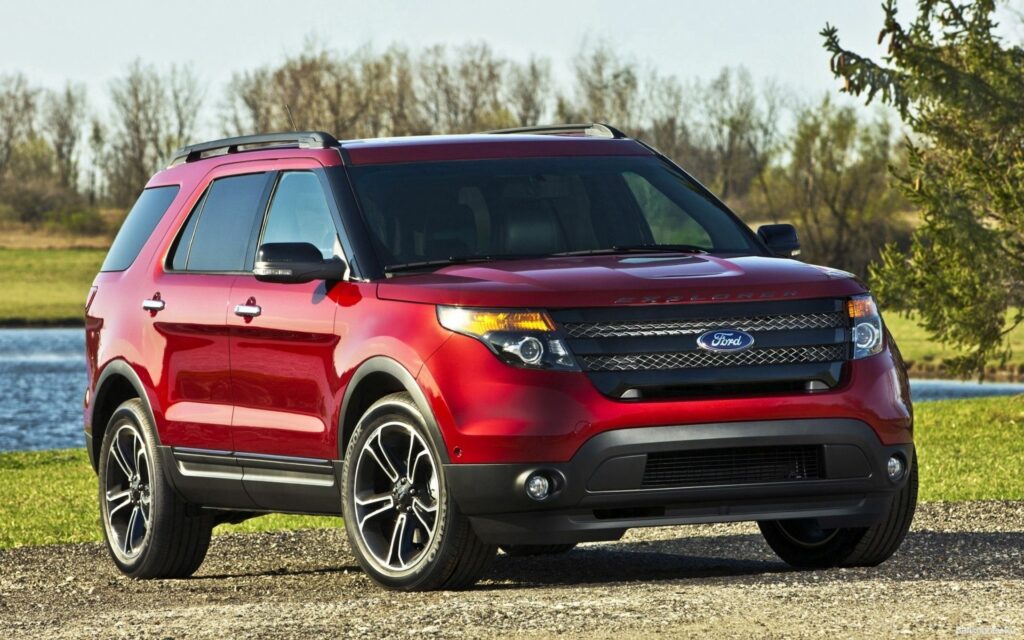 Red Ford Explorer in Stunning Nature - Automotive Excellence Wallpaper