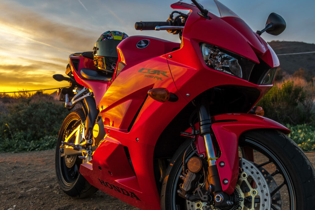 Striking Red Honda CBR Motorcycle Wallpaper at Sunset