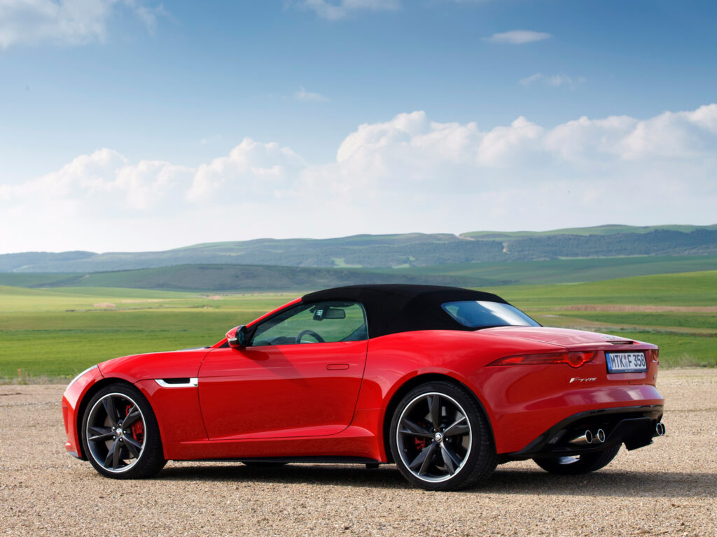 Stunning Red Jaguar F-Type V8 S Wallpaper with Scenic Background