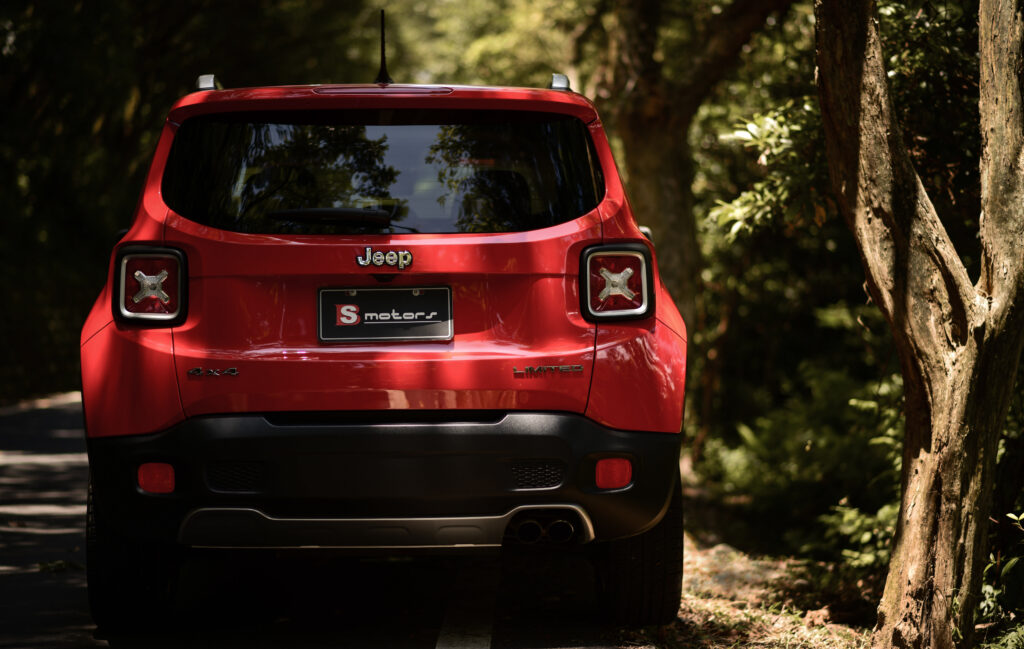 Red Jeep Renegade Wallpaper: Adventure Awaits in Greenery