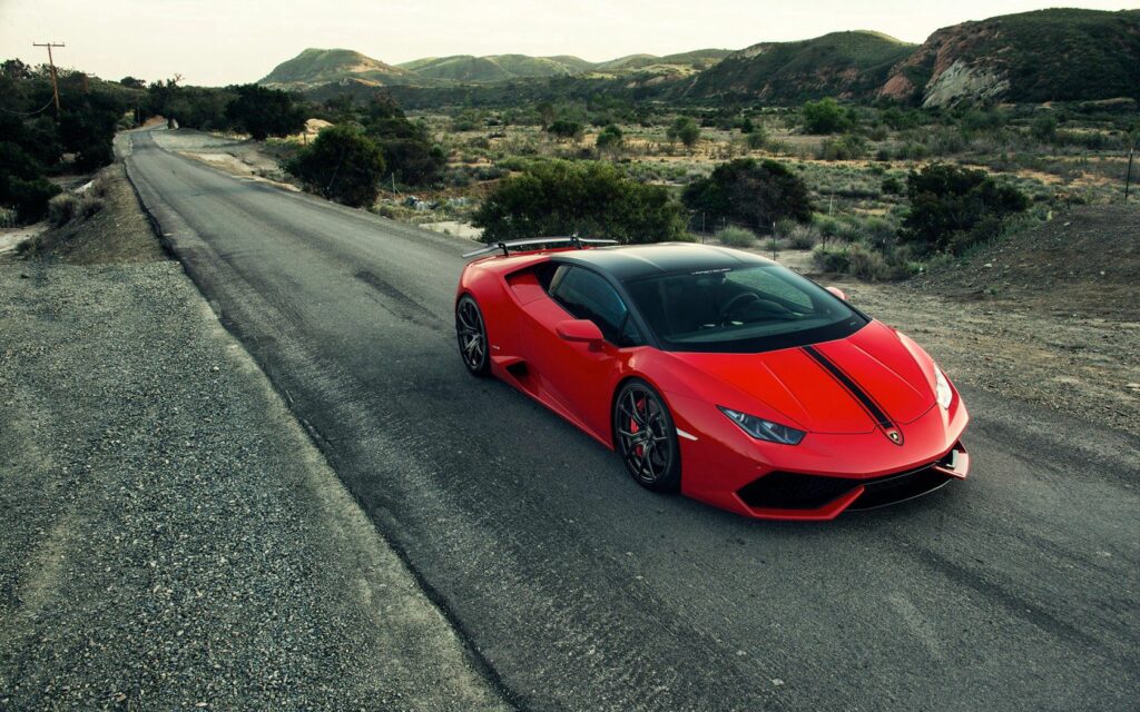 Red Lamborghini Huracán Scenic Wallpaper: Sleek Design & Green Hills