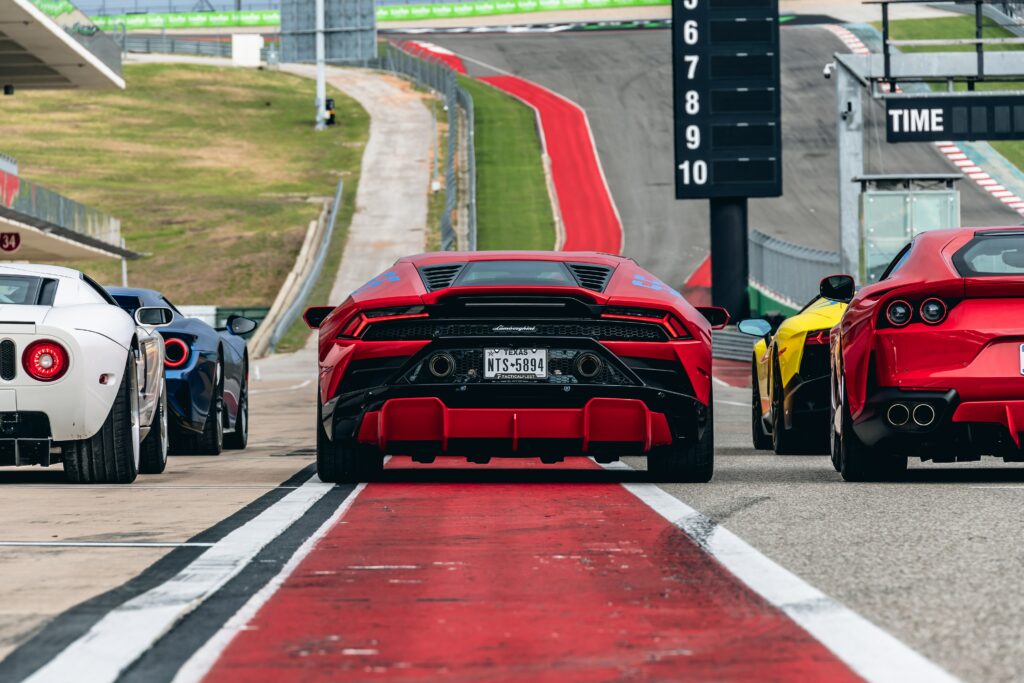 Red Lamborghini on Racetrack: A Thrilling Sports Car Wallpaper