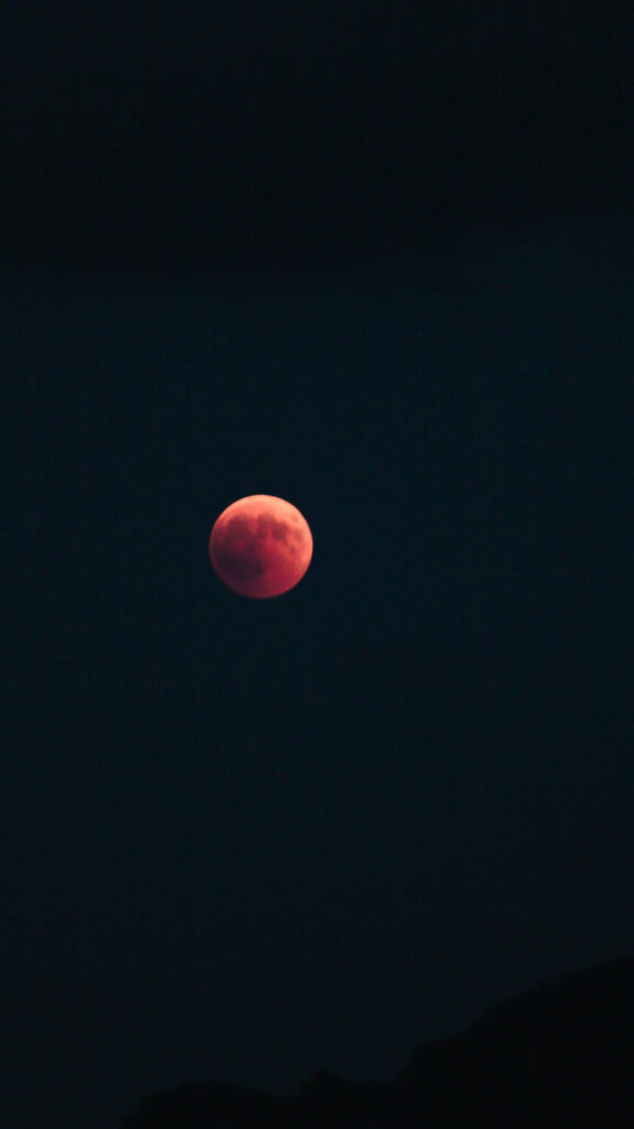 Stunning Red Lunar Eclipse Wallpaper Against Dark Night Sky