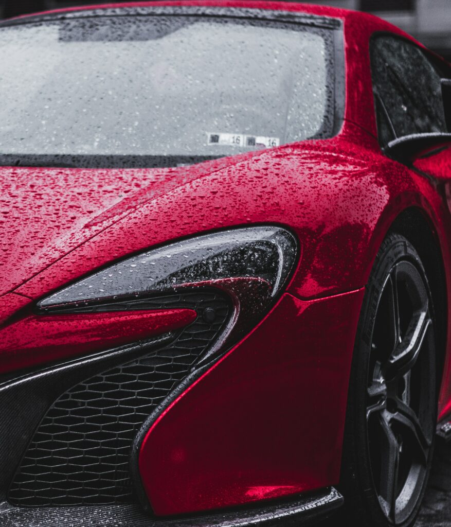 Stunning Red McLaren P1 Front View with Raindrops - Cinematic Design Wallpaper