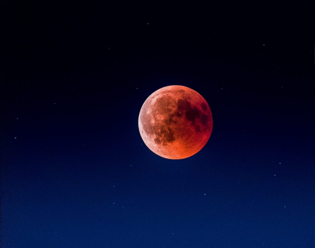 Stunning Red Moon Wallpaper: Twilight Eclipse Over Starry Night Sky