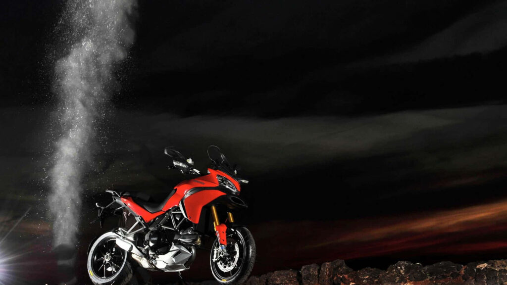 Thrilling Red Motorcycle Wallpaper: Adventure Under Night Sky