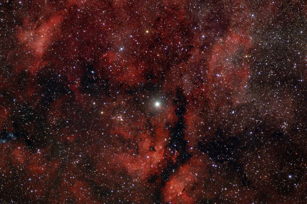 Stunning Red Nebula Wallpaper Background with Starry Cosmic Scene