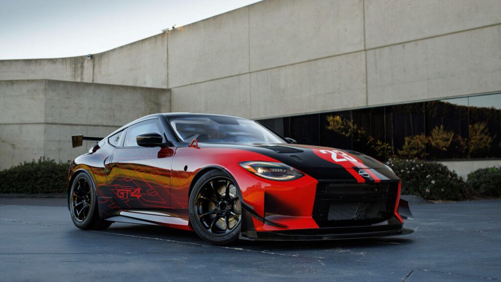 Stunning Red Nissan Sports Car Wallpaper with Bold Racing Design