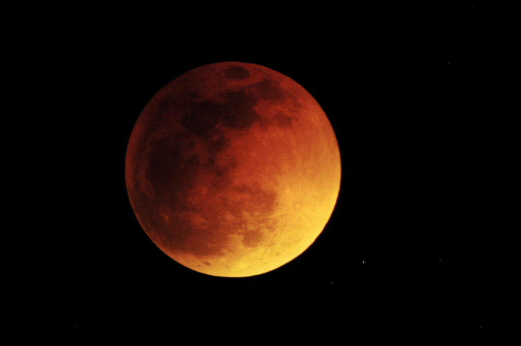 Stunning Red-Orange Lunar Eclipse Wallpaper Background