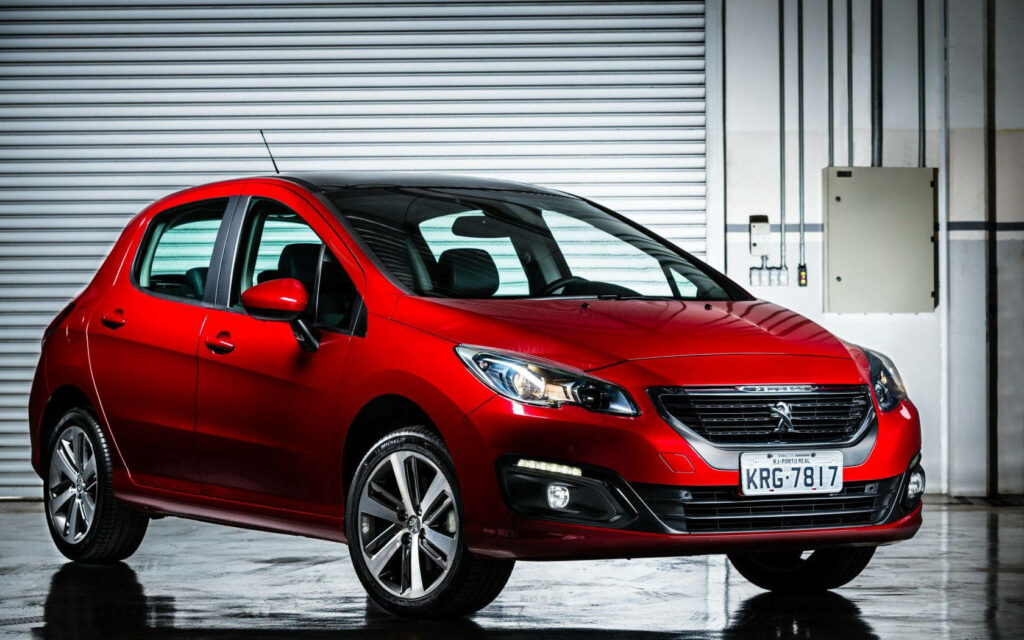 Stunning Red Peugeot 208 Wallpaper for Urban Environment