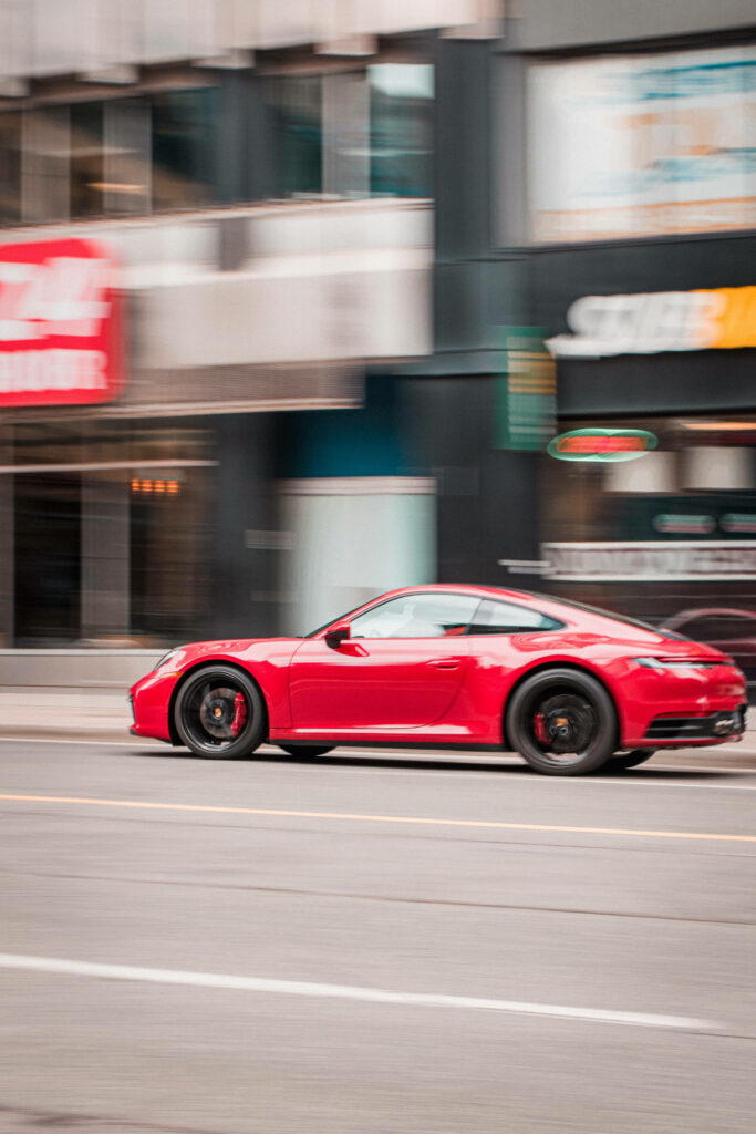 Stunning Red Porsche 911 Wallpaper - Dynamic Blur for Car Lovers