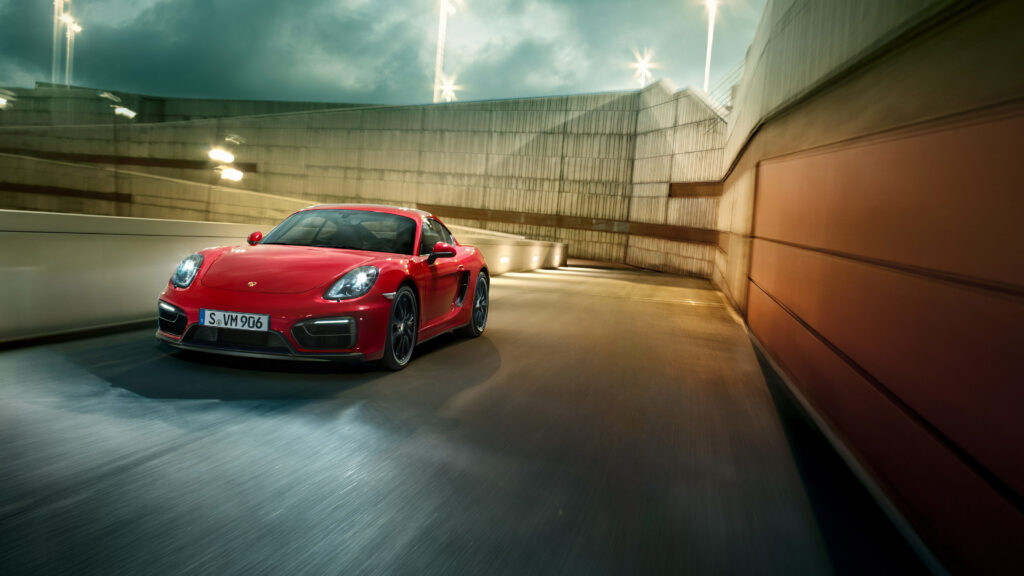 Stunning Red Porsche Cayman GTS in Urban Setting | Dynamic Wallpaper