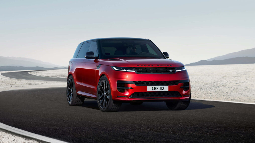 Luxurious Red Range Rover Evoque Wallpaper on Desert Road
