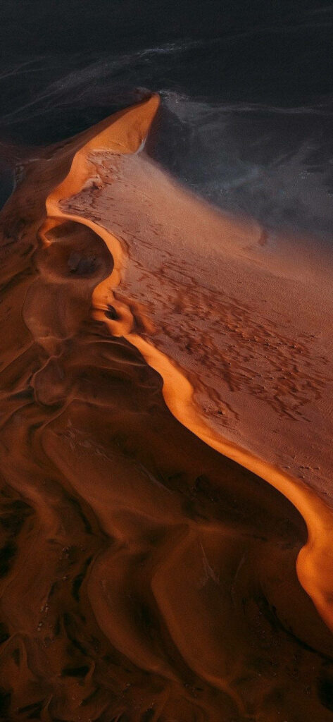 Breathtaking Red Sand Dunes Wallpaper: Serene Desert Landscape