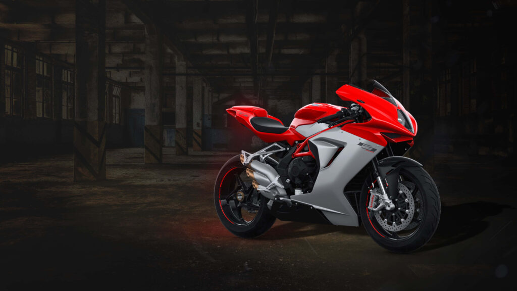 Vibrant 4K Sportbike Wallpaper: Red Power in Industrial Setting