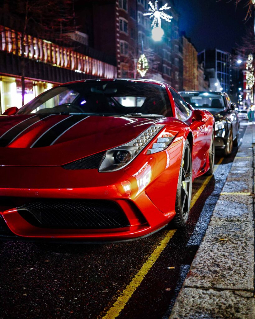 Stunning Red Sports Car Night Wallpaper: Urban Elegance & Power