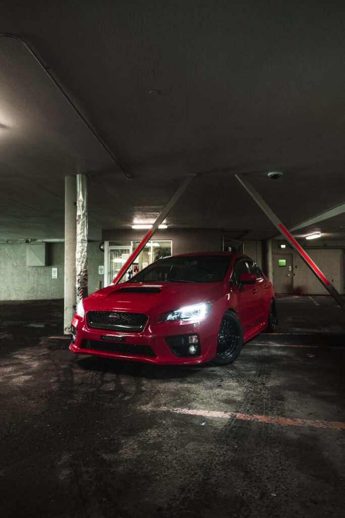 Red Subaru Car Wallpaper: Sleek Design in Industrial Garage