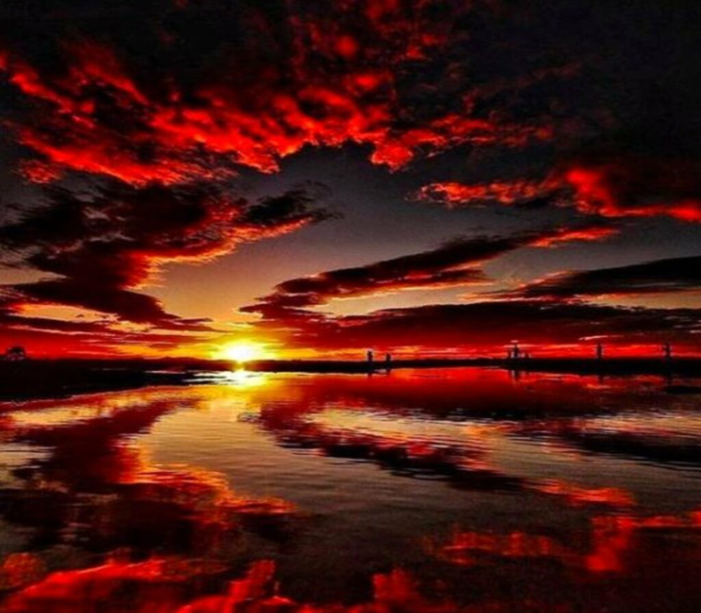Mesmerizing Red Sunset HD Wallpaper Over Calm Waters Background