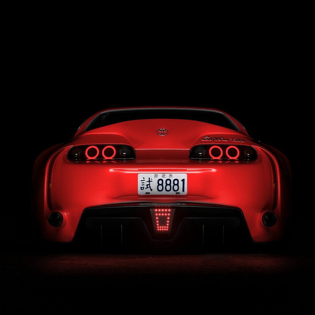 Stunning Red Toyota Supra Rear View Wallpaper on Dark Background