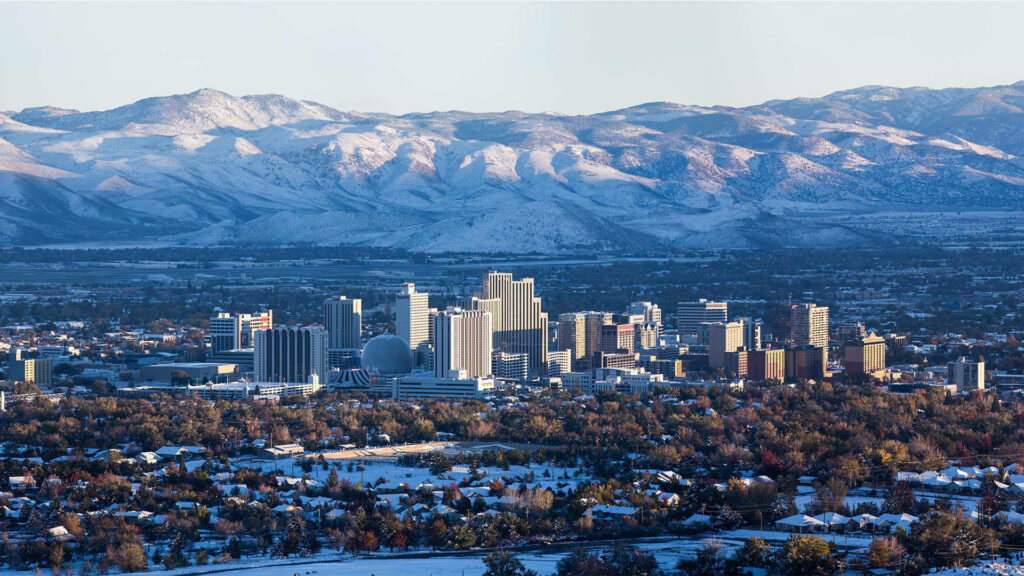 Stunning Reno Skyline Wallpaper: Snowy Mountains & Winter Sky