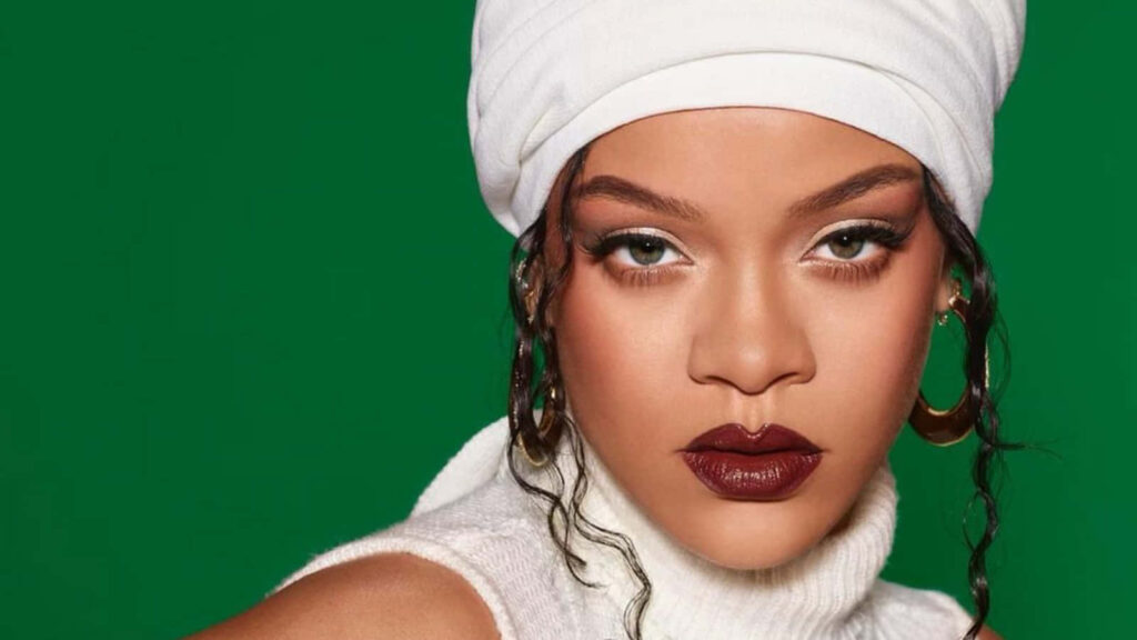 Rihanna's Striking Beauty Wallpaper: Bold Red Lips & Green Background